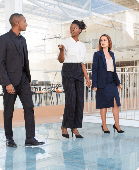 Three people discussing business