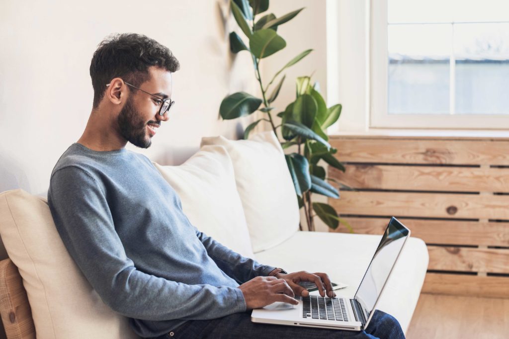 homebuyer is closing on home from his computer